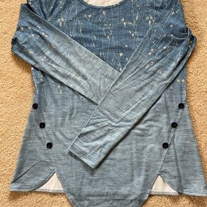 New, women’s long sleeve tunic with button detail in leaf print and blue shades.